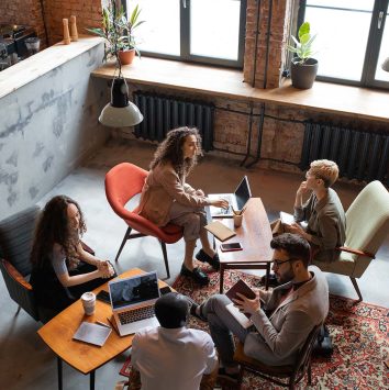 group-of-intercultural-co-workers-discussing-worki-YGHNKAK.jpg